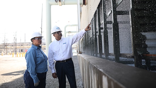 Man and woman inspect facility to ensure sustainable operations - Ecolab